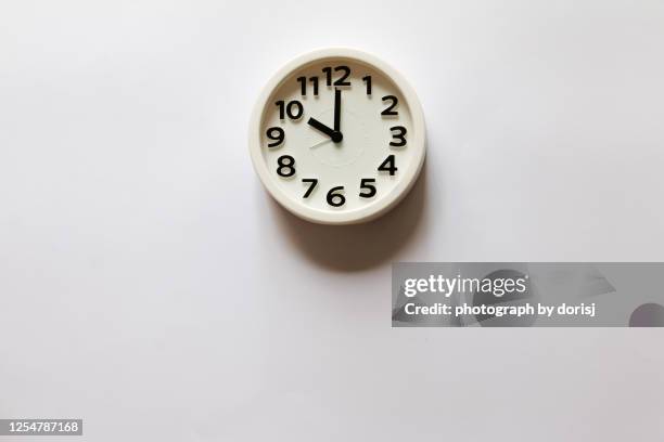 alarm clock showing 10 o' clock - clock on wall stock pictures, royalty-free photos & images