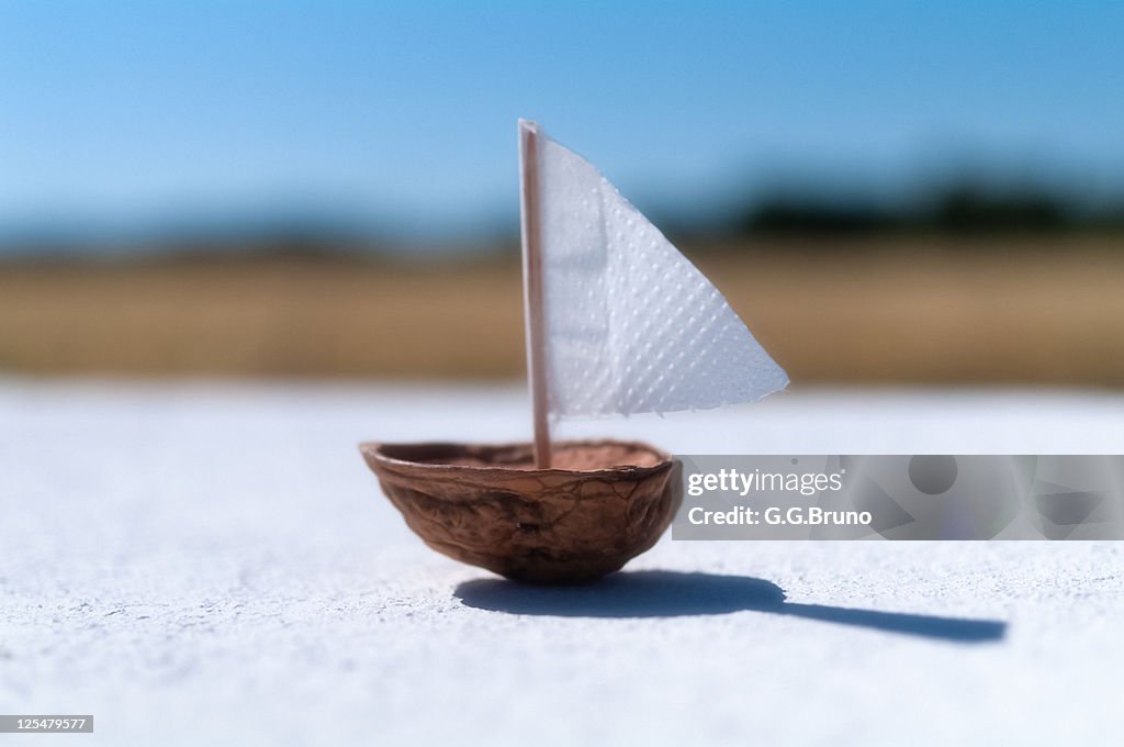 Boat made from half nutshell and paper