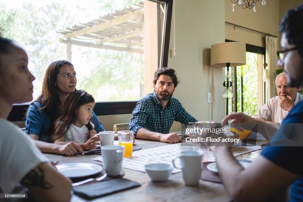 Angry dad enjoying a moment of silence with his family