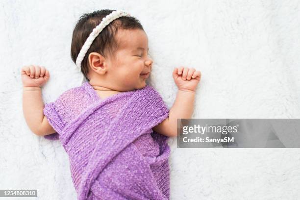 sleeping newborn baby girl - baby girls stock pictures, royalty-free photos & images