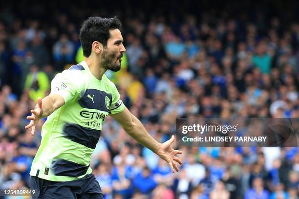 Manchester City's German midfielder Ilkay Gundogan celebrates scoring his team's third goal during the English Premier League football match between...