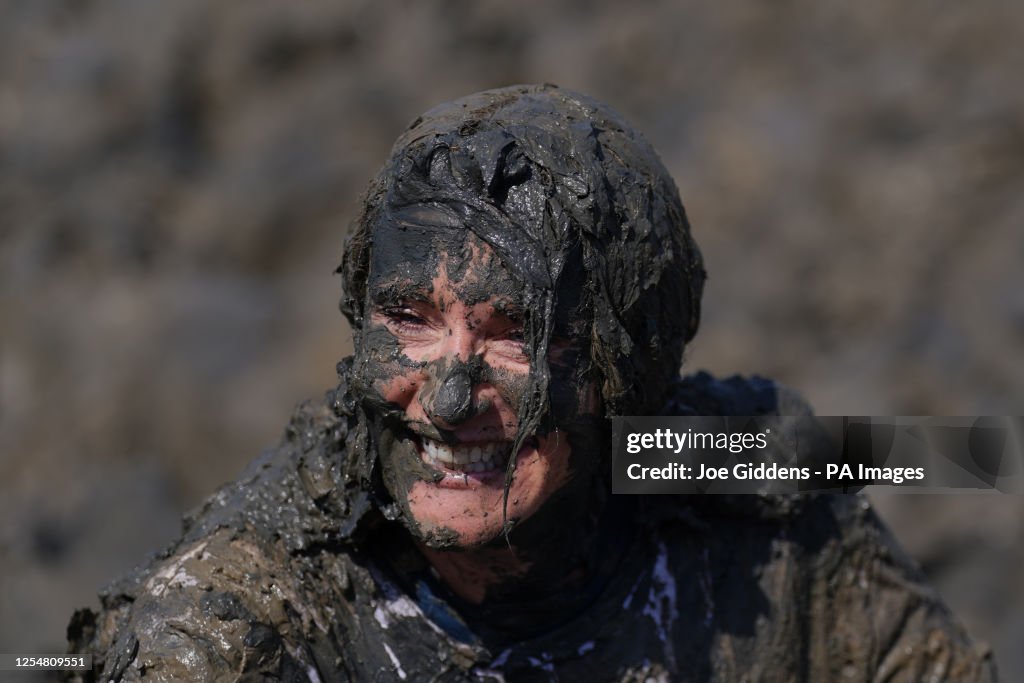 Mudf Rice Competitors take part in the annual Maldon Mud Race, a charity event ...