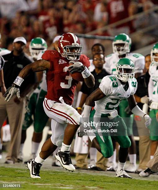 Running back Trent Richardson of the Alabama Crimson Tide breaks away for a 58-yard touchdown run past defensive back Steven Ford of the North Texas...