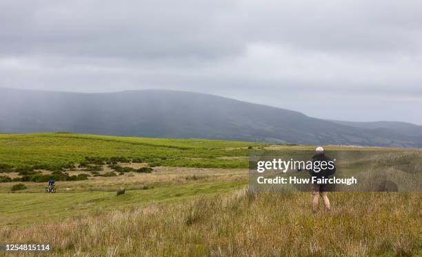 General view of a photographer working on a cycle shoot on the Brecon Beacons on July 6, 2020 in Crickhowell, Wales, United Kingdom. Access to the...