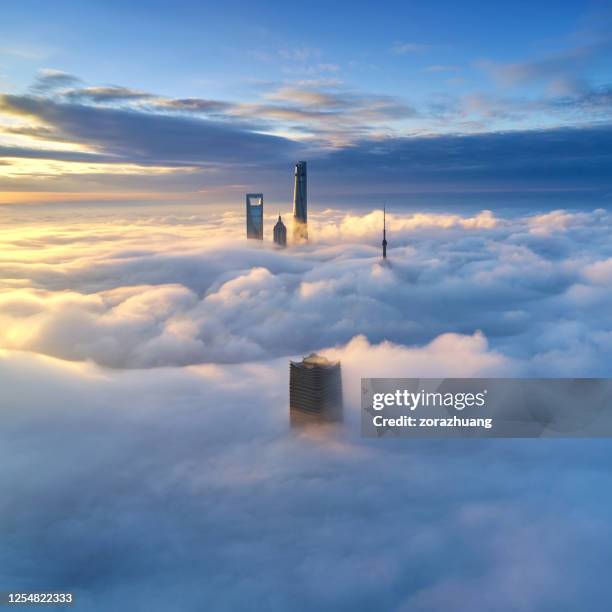 aerial view of shanghai skyline on thick cloud, china - cloudscape buildings stock pictures, royalty-free photos & images