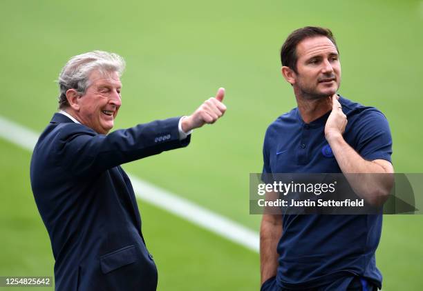 Roy Hodgson, Manager of Crystal Palace and Frank Lampard, Manager of Chelsea speak prior t the Premier League match between Crystal Palace and...