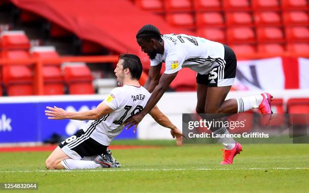 Harry Arter of Fulham is congratulated by Joshua Onomah of Fulham after scoring the opening goal during the Sky Bet Championship match between...