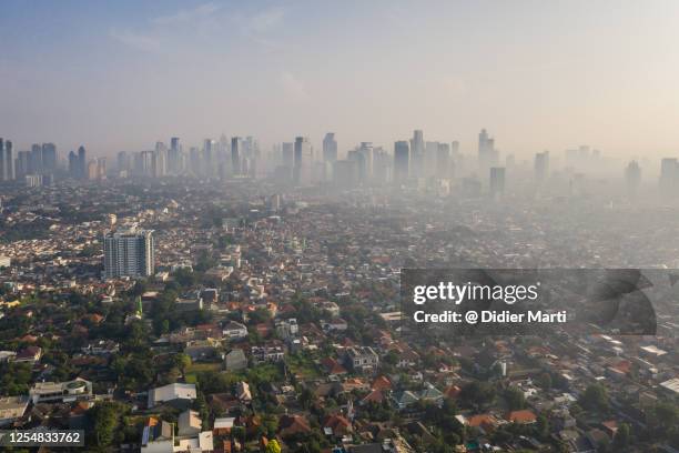 aerial panorama of the jakarta skyline in indonesia capital city. - social inequality ストックフォトと画像