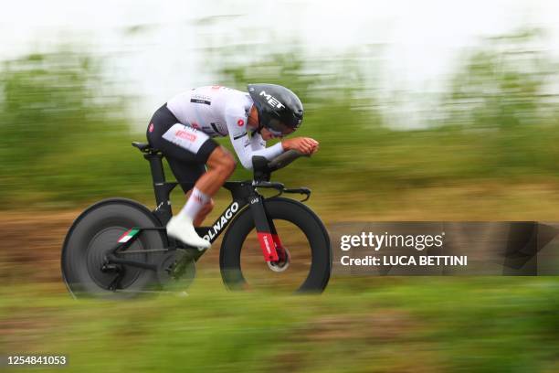 Team Emirates's Portuguese rider Joao Almeida competes during the ninth stage of the Giro d'Italia 2023 cycling race, a 35 km individual time trial...