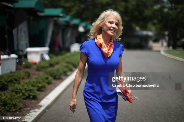 Kellyanne Conway, counselor to President Donald Trump, walks back into the West Wing following an interview with FOX outside the White House July 07,...