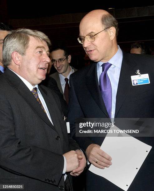 France's Transport Minister Jean-Claude Gayssot speaks with Canada's Transport Minister David Collenette before the start of an International Civil...