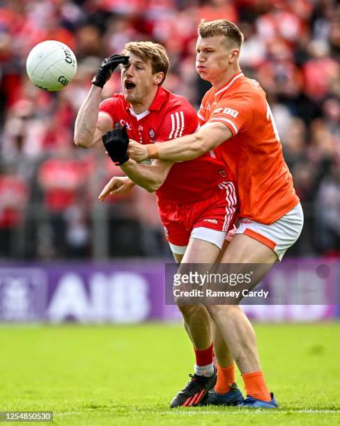 Monaghan , Ireland - 14 May 2023; Brendan Rogers of Derry in action against Rian O'Neill of Armagh during the Ulster GAA Football Senior Championship...
