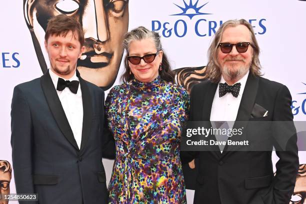 Alfie Oldman, Gisele Schmidt and Gary Oldman arrive at the 2023 BAFTA Television Awards with P&O Cruises at The Royal Festival Hall on May 14, 2023...