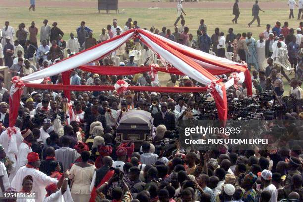 The casket of slain Nigerian Attorney-General and Justice Minister Bola Ige is carried to a podium 11 January 2002 at Liberty Stadium in Ibadan for...