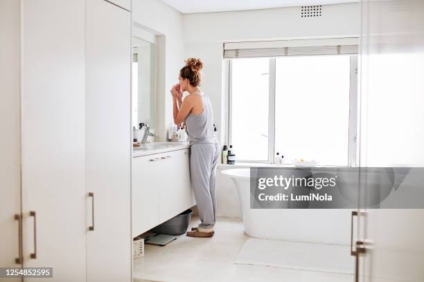 self care is more than beauty, it's about loving yourself - woman-looking-into-mirror-full-body stock pictures, royalty-free photos & images