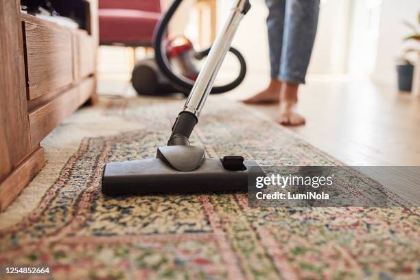 dust mites don't stand a chance - vacuum cleaner woman stock pictures, royalty-free photos & images