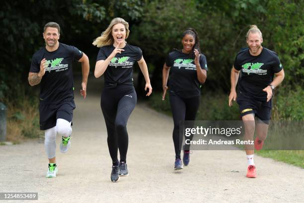 Moderator Florian Ambrosius, actress Nina Ensmann, actress Liz Baffoe and athletic coach Arne Greskowiak run during the photo call for "ZeroHungerRun...