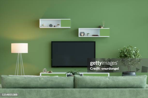 smart tv mockup with blank screen in green room - tv on wall stock pictures, royalty-free photos & images