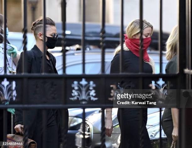 Bianca Butti and Amber Heard arrive for Johnny Depp's libel case against the Sun Newspaper at the Royal Courts of Justice, Strand on July 07, 2020 in...