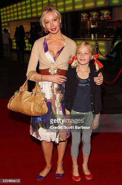 Australian actress Kimberley Davies and her daughter Isabella arrive at the Melbourne Premiere of 'Monte Carlo' at Hoyts Cinemas Melbourne Central on...