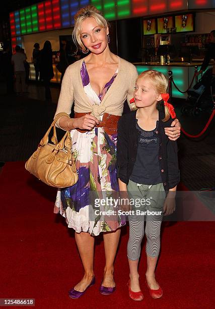 Australian actress Kimberley Davies and her daughter Isabella arrive at the Melbourne Premiere of 'Monte Carlo' at Hoyts Cinemas Melbourne Central on...
