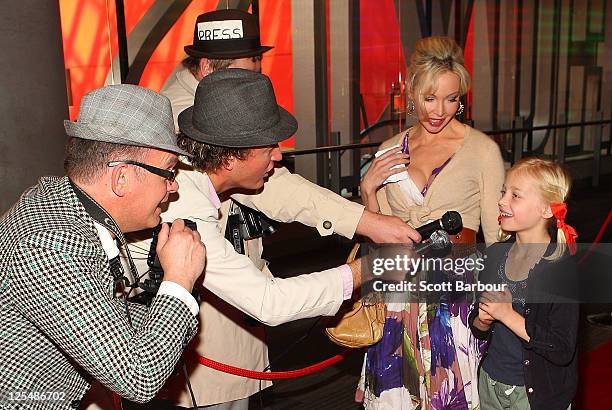 Australian actress Kimberley Davies and her daughter Isabella arrive at the Melbourne Premiere of 'Monte Carlo' at Hoyts Cinemas Melbourne Central on...