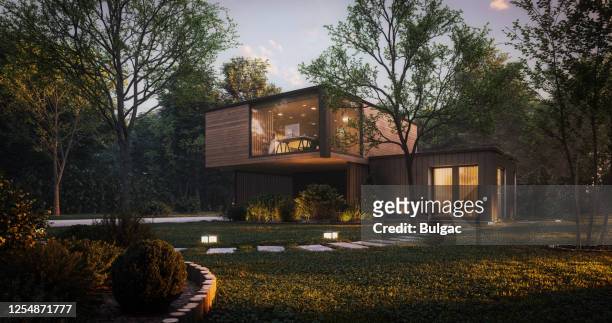 moderne minimalistische familievilla - verlicht stockfoto's en -beelden