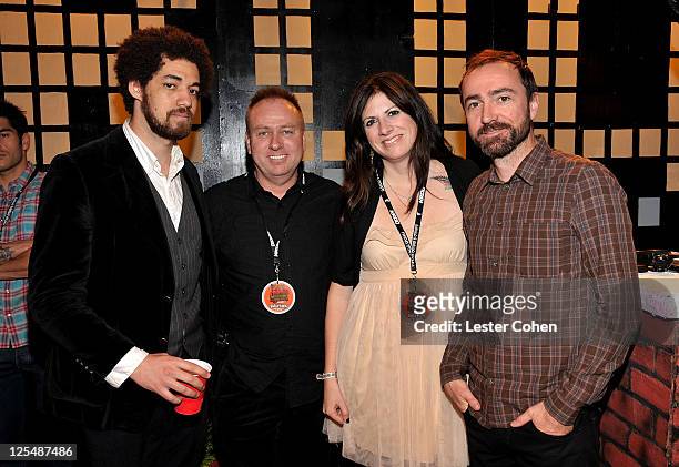 Musician Brian Burton of Broken Bells, KROQ's Gene Sandbloom, KROQ's Lisa Worden and musician James Mercer of Broken Bells pose backstage at 2010...