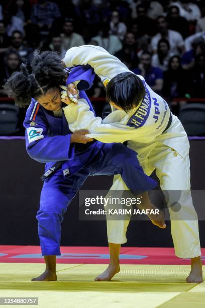 Japan's Haruka Funakubu competes against France's Sarah-Leonie Cysique during the teams mixed final bout at the World Judo Championship in Doha on...