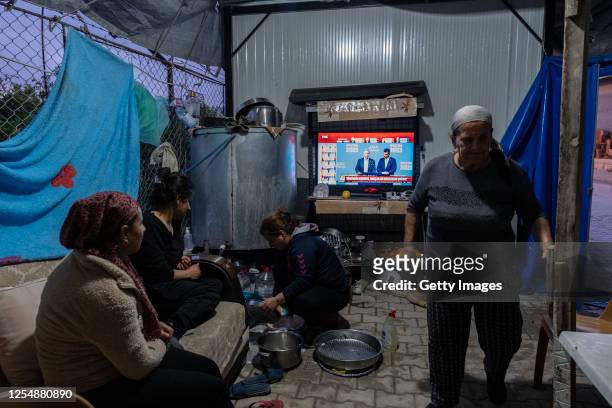 Dinar family watches the election results in their tents on May 14, 2023 in Antakya, Turkey. Today, President Recep Tayyip Erdogan faces his biggest...