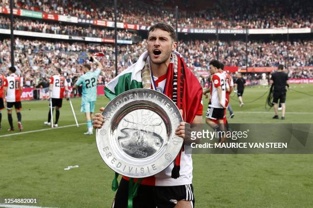 Santiago Gimenez of Feyenoord celebrates with the championship trophy after winning the Dutch Eredivisie football match between Feyenoord and Go...