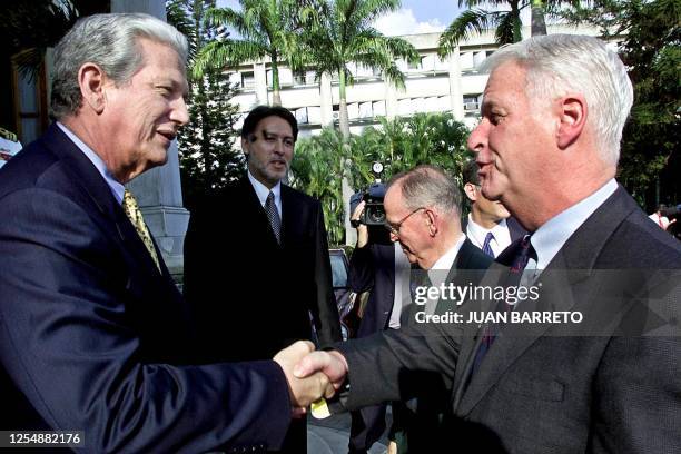 Venezuelan Foreign Affairs Minister Luis Alfonso Davila greets US congressmen Rep. William Delahunt , D-MA, and Rep. Cass Ballenger , R-NC, at the...