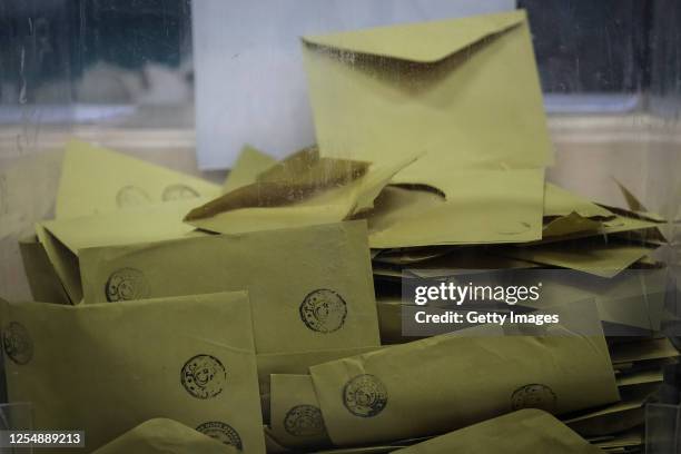 Empty ballot envelopes in a box while election officials prepare ballot papers for counting after the voting process on May 14, 2023 in Istanbul...