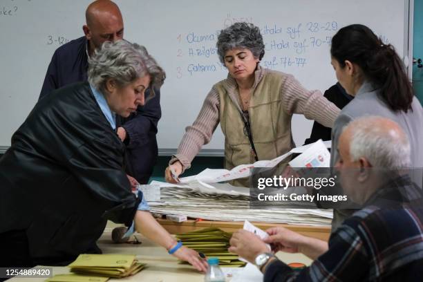 Election officials prepare ballot papers for counting after the voting process on May 14, 2023 in Istanbul Turkey. On May 14th, President Recep...