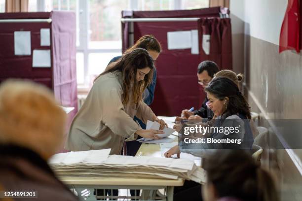 Officials count ballots at a polling station during presidential and parliament elections in the Kadikoy district of Istanbul, Turkey, on Sunday, May...