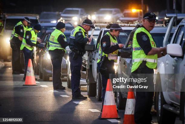 Police stop and question drivers at a checkpoint on July 8, 2020 in Albury, Australia. The NSW-Victoria border closed at midnight, Wednesday 8 July....