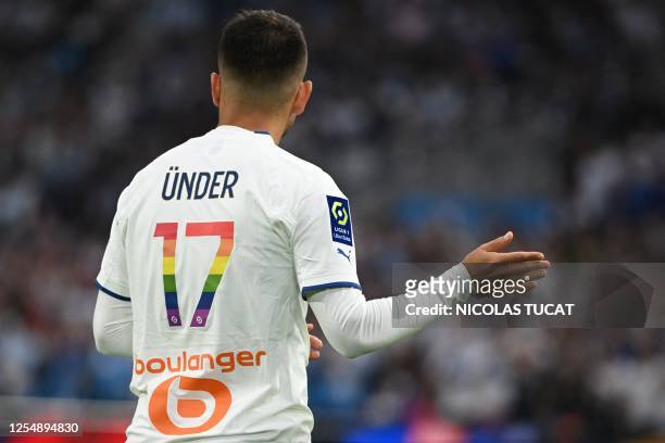 Marseille's Turkish forward Cengiz Under gestures during the French L1 football match between Olympique Marseille and SCO Angers at Stade Velodrome...