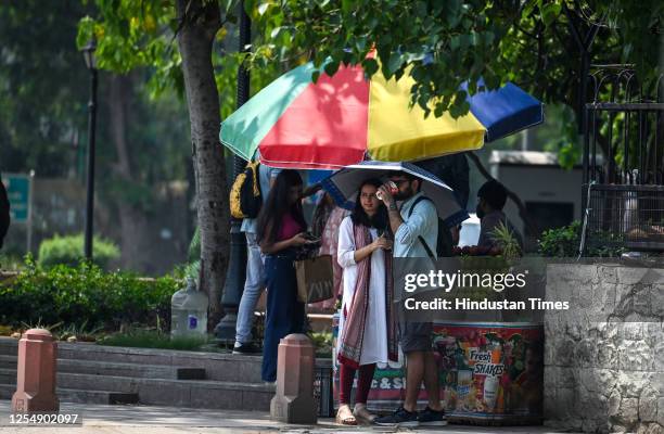 Commuters out on a hot summer day at Kartavya Path, on May 14, 2023 in New Delhi, India.
