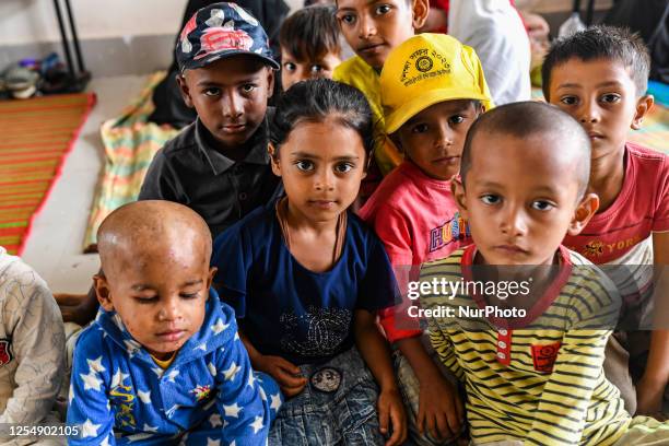 Bangladeshi children took shelter in the Cyclone Shelter in Shahpori island on the outskirts of Teknaf, on May 14 ahead of Cyclone Mocha's landfall.