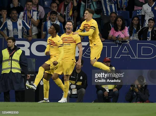 Alejandro Balde of Barcelona celebrates with his team mates after scoring a goal during the Spanish league football match between RCD Espanyol vs FC...