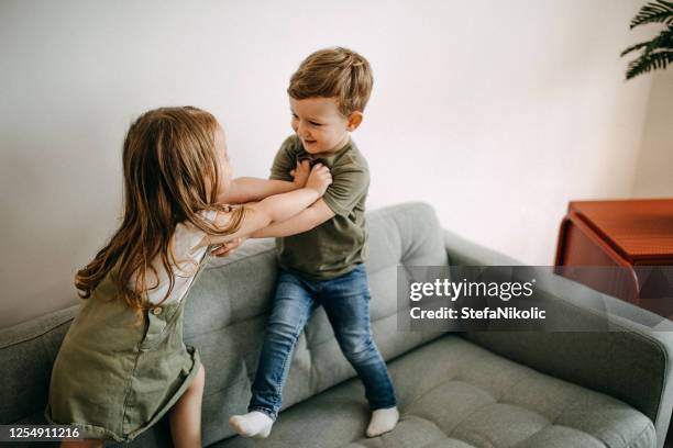 let's scream - sibling fight stock pictures, royalty-free photos & images
