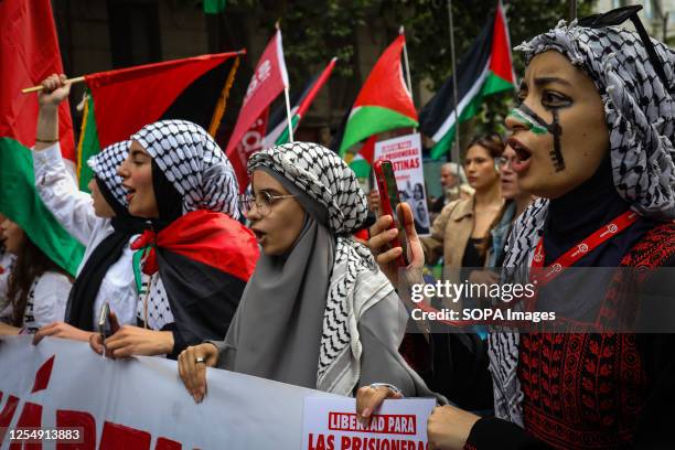 Young protesters, march with Palestinian flags and a banner as they chant slogans during the demonstration. Palestinian residents in the city of...