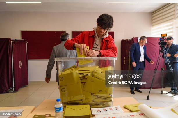 Man casts his vote in a ballot box at Saffet Çebi school polling station. 64 millions Turkish citizens are called to head to the polls today to vote...