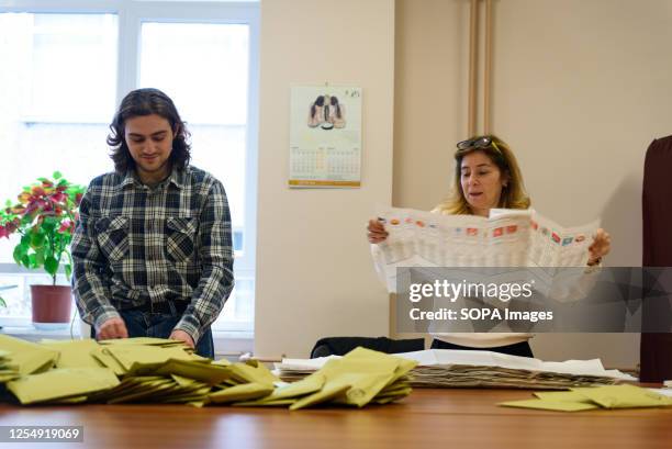 Voting assistance officers open ballot papers during the vote count in Buyuk Esma school in the city center. Millions of turkish citizens headed to...