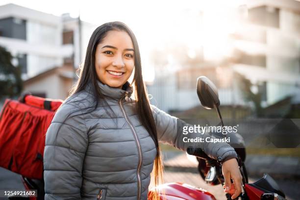 delivery guy portrait - motogirl, motoboy - motoboy stock pictures, royalty-free photos & images