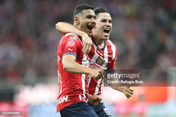 Gilberto Sepúlveda of Chivas celebrates with teammate after scoring the team's first goal during the quarterfinals second leg match between Chivas...