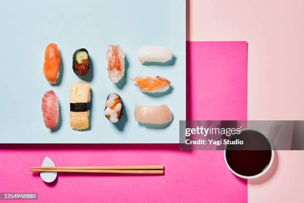 sushi with a colorful background - chopsticks stock-fotos und bilder