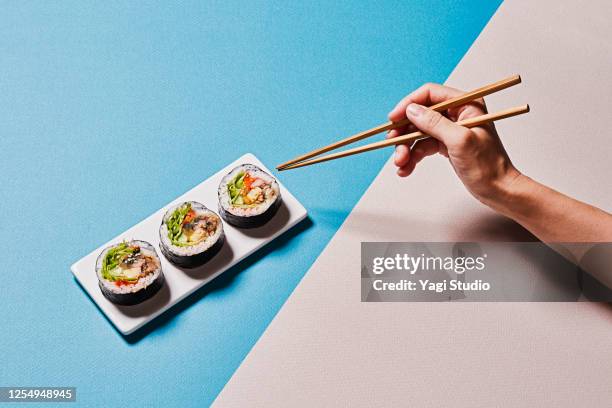 colorful color scheme background and korean gimbap - 箸 ストックフォトと画像