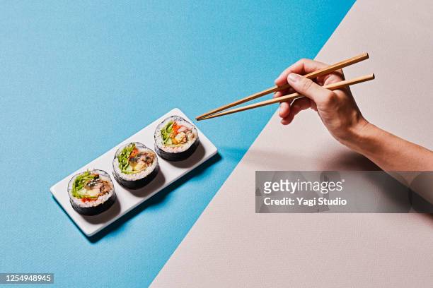 colorful color scheme background and korean gimbap - chopsticks stock pictures, royalty-free photos & images