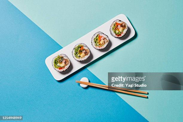 colorful color scheme background and korean gimbap - chopsticks stock pictures, royalty-free photos & images